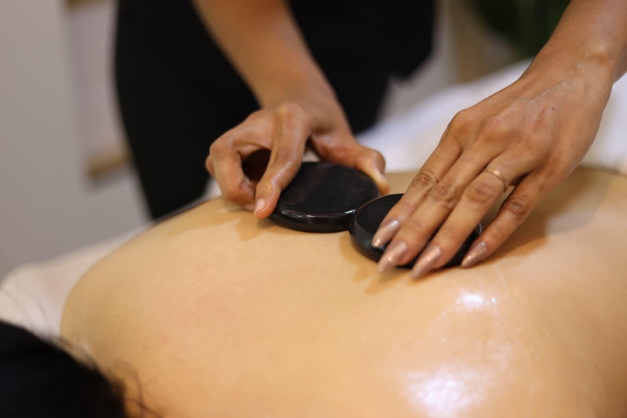 Hot stone massage treatment at Whispering Waters Spa