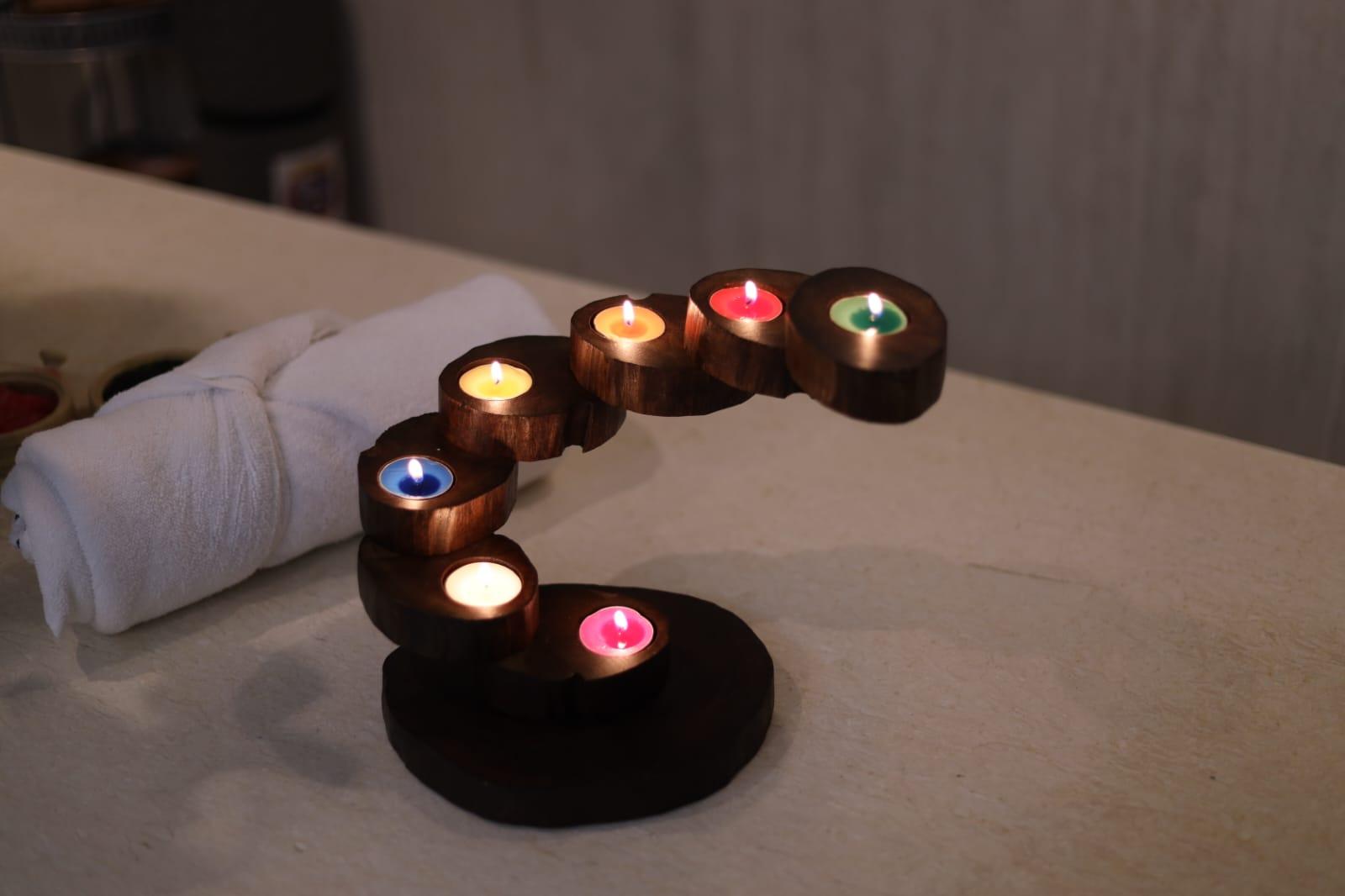 Chakra candle ritual display at Whispering Waters Spa